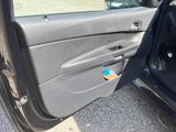 a car door with a blue sticker on the side of it