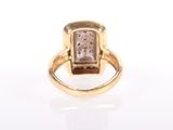 an image of a gold ring with a brown diamond in it