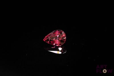 a red diamond on a black surface
