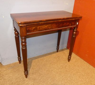 a small wooden table with a drawer on top of it