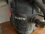 a vacuum that is sitting on the floor in the room