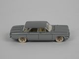 a toy car that is sitting on a white surface