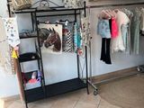an image of a clothing rack with clothes on it
