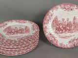 un lot de six assiettes rouges et blanches ornées de châteaux