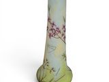 a glass vase with a floral design on it