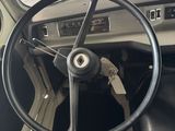 steering wheel and dashboard of a car in a garage