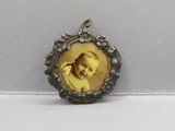 a close up of a picture of a baby in a picture frame