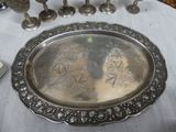 a silver plate with a picture of a man and a woman on it