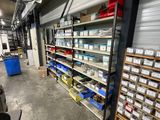 a room with a lot of shelves and bins in it