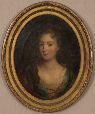 un tableau représentant une femme en robe verte, dans un cadre doré