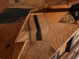 a cat that is sitting on top of a wooden table