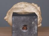 an image of a sculpture of a rock with a hole in it