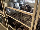a metal rack with a lot of metal items on it