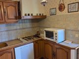 a small kitchen with a microwave and a dishwasher in it