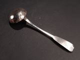 a spoon that is sitting on a table