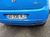 a blue car that is parked in a parking lot