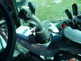 a close up of a steering control on a tractor