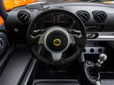 the interior of a sports car with a steering wheel and dashboard