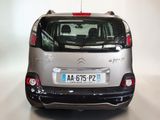 a silver citrole parked in a white room