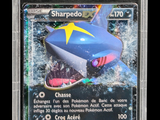 a close up of a pokemon trading card with a shark on it