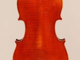 an old violin with a very long neck and a very long back