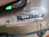 a close up of a motor bike with a sticker on it