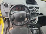 a dashboard of a small car with a steering wheel