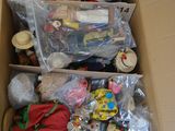 a cardboard box filled with toys and other items