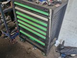 a workbench with tools on top of it in a garage