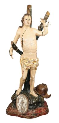 une statue représentant un homme tenant une guitare et un tambour