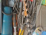 a pile of tools and tools sitting on a table