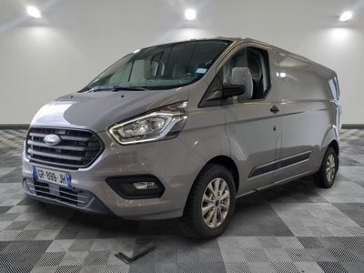 the new ford transit van is parked on a checkered floor