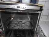 an open oven with a lot of food inside of it