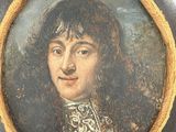 portrait of a young man in a black and gold outfit