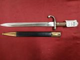 a close up of a knife and a sword on a red cloth