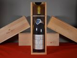 a bottle of wine in a wooden box on a table