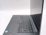 a laptop computer sitting on top of a white table