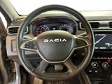 the interior of a car with a steering wheel and dashboard controls