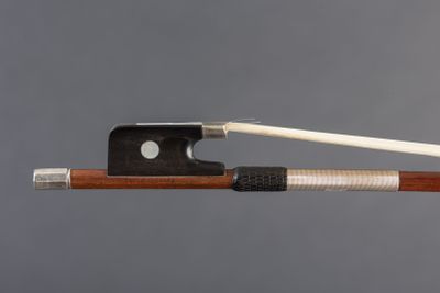 the bow is made of wood and has a white string
