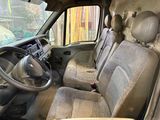 the interior of a van with a steering wheel and a dashboard