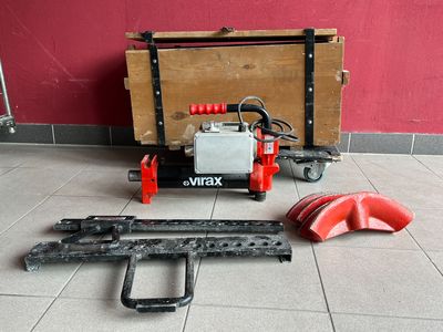 a machine that is sitting on the floor next to a box