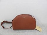 a brown purse with a tag on it sitting on top of a table