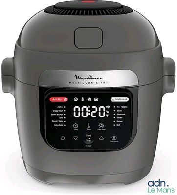an image of a digital pressure cooker sitting on a white surface