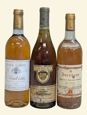 three bottles of wine sitting next to each other on a table