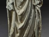 an image of a statue of a woman holding a book