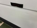 a close up of a sticker on the side of a white truck