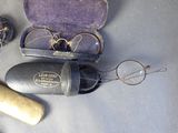 a pair of glasses and a pair of eyeglasses in a case