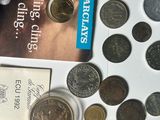 a lot of coins and a book on the table