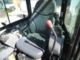 a view of the driver ' s seat of a construction vehicle