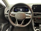 the interior of a car with a steering wheel and dashboard controls